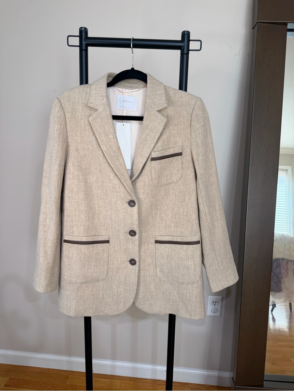Gorjana Beige Blazer with brown leather trim.